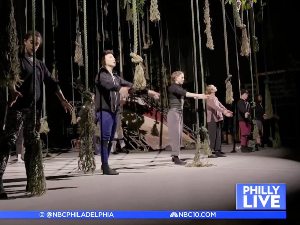 BalletX Dance eXchange students performing on stage with bright smiling faces